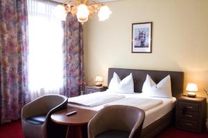 Letto o letti in una camera di Hotel Alter Telegraf