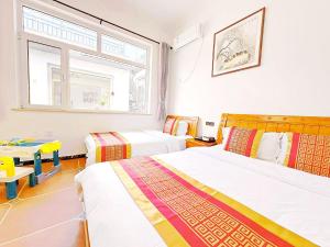 Krevet ili kreveti u jedinici u okviru objekta Beijing Great Wall Shiguang Homestay