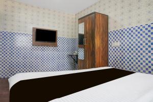 Ένα ή περισσότερα κρεβάτια σε δωμάτιο στο Hotel O Corporate Stay +21 φωτογραφίες