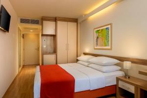 Postel nebo postele na pokoji v ubytování Hotel Aurora