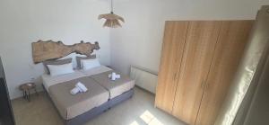 Posteľ alebo postele v izbe v ubytovaní Mykonian Tramonti Villas