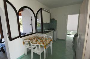 Kuchyň nebo kuchyňský kout v ubytování Appartamenti I Lauri