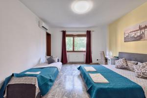 Postel nebo postele na pokoji v ubytování Bellavista Palladio