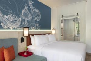 Ein Bett oder Betten in einem Zimmer der Unterkunft Avani Plus Koh Lanta Krabi Resort