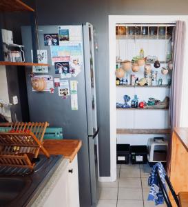 Kuchyň nebo kuchyňský kout v ubytování Cozy appartement vue mer