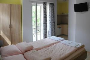 Ένα ή περισσότερα κρεβάτια σε δωμάτιο στο Apartments Kaskade