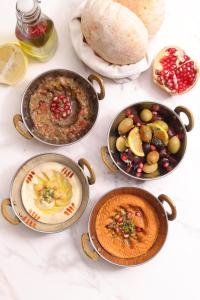 a group of three bowls of food on a table at InterContinental Bangkok by IHG in Bangkok