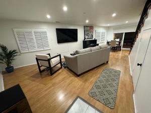 a living room with a couch and a television at Echo House in Los Angeles