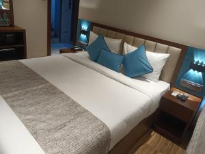 Postel nebo postele na pokoji v ubytování Hotel Flexi Residency Mumbai