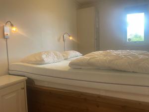 En eller flere senge i et værelse på Sentral, Hc-Friendly Apartment