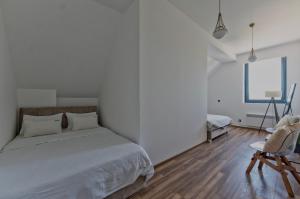 En eller flere senger på et rom på Onix Residence
