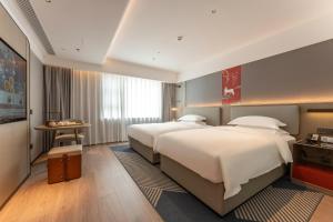 ECHENG Hotel, Jianghan Road Pedestrian Street, Wuhan River Beach客房内的一张或多张床位