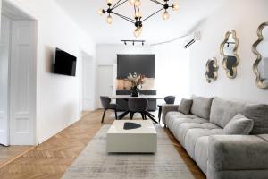 a living room with a couch and a table at Belgrade CITY CENTER Apartments PARKING 12e - 7 min by walk TERAZIJE in Belgrade