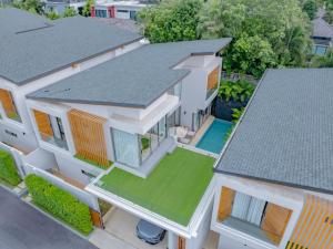 an aerial view of a house with a yard at 3BR Villa Z by NLA in Ban Pak Lak