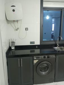 Kuchyň nebo kuchyňský kout v ubytování Appartement Alhoceima