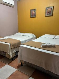 Postel nebo postele na pokoji v ubytování La Lima Park Hotel
