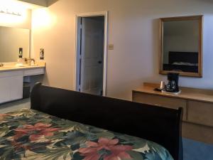 Postel nebo postele na pokoji v ubytování Bent Tree Motel