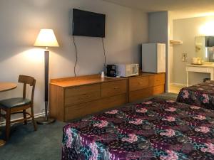 Postel nebo postele na pokoji v ubytování Bent Tree Motel
