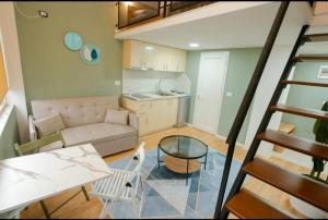 a living room with a couch and a table at Alvin House in Shkodër