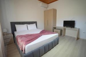 Postel nebo postele na pokoji v ubytování Jons Apartment