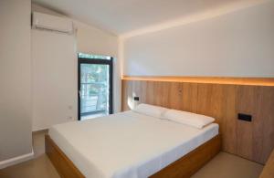 Ένα ή περισσότερα κρεβάτια σε δωμάτιο στο Villa Aqua +17 φωτογραφίες