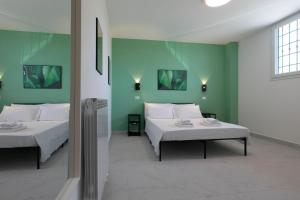 Postel nebo postele na pokoji v ubytování AMINA Guest House