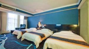 Un ou plusieurs lits dans un hébergement de l'établissement Guilin Sapphire hotel