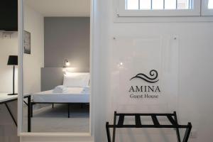 Postel nebo postele na pokoji v ubytování AMINA Guest House