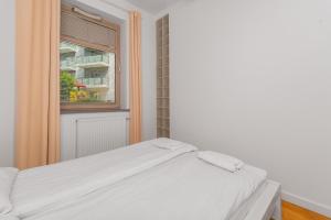 Posteľ alebo postele v izbe v ubytovaní Grand Apartments - Apartament Aqua 3 - Rezydencja Marina Gdańsk