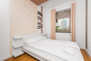 Posteľ alebo postele v izbe v ubytovaní Grand Apartments - Apartament Aqua 3 - Rezydencja Marina Gdańsk