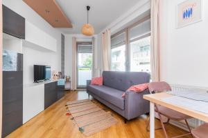 Televízia a/alebo spoločenská miestnosť v ubytovaní Grand Apartments - Apartament Aqua 3 - Rezydencja Marina Gdańsk