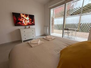 Ένα ή περισσότερα κρεβάτια σε δωμάτιο στο Luxury Zen & Love Studio - Proche Paris & Disneyland