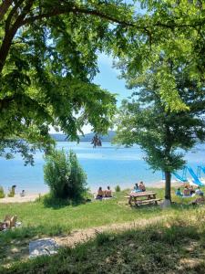 a group of people sitting on the beach at Maison de village à Riez de 87m2 in Riez