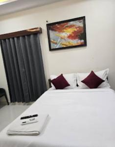 Postel nebo postele na pokoji v ubytování Hotel Yuva