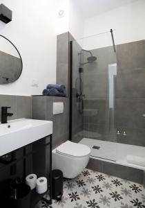 a bathroom with a toilet and a sink and a shower at Nona Marija Centar Apartments in Pula