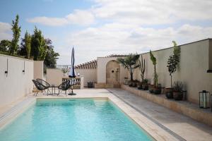 a swimming pool in the backyard of a house at Hotel Golden Key, 4 Stars Superior in Nitra