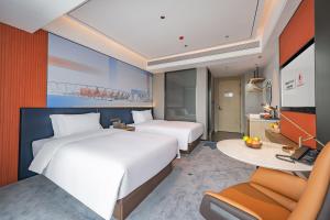 Letto o letti in una camera di Foshan Jifeng International Hotel