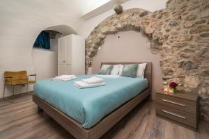 Ένα ή περισσότερα κρεβάτια σε δωμάτιο στο Casa Monica Ledro Volt
