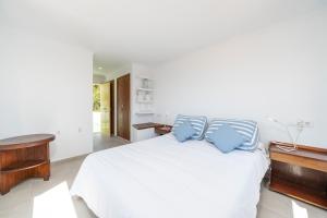A bed or beds in a room at Casa Morant on the promenade MHM