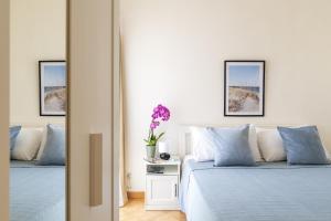 Ένα ή περισσότερα κρεβάτια σε δωμάτιο στο Casa Vivi ad Arbatax