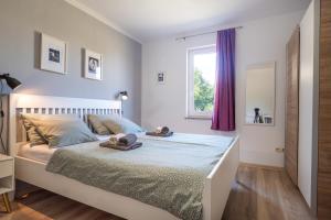 Postel nebo postele na pokoji v ubytování Apartman 6 + 2