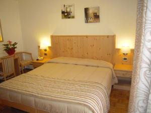 Postel nebo postele na pokoji v ubytování Miramonti Hotel
