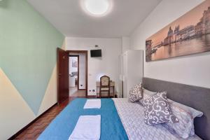 Postel nebo postele na pokoji v ubytování Bellavista Palladio