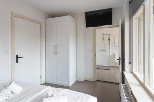 Ein Bett oder Betten in einem Zimmer der Unterkunft Flamingo Beach Apartments