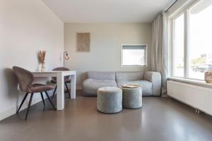 Ein Sitzbereich in der Unterkunft Flamingo Beach Apartments