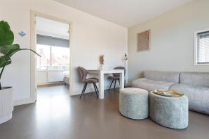 Ein Sitzbereich in der Unterkunft Flamingo Beach Apartments