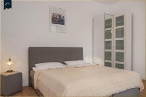 Ein Bett oder Betten in einem Zimmer der Unterkunft Villa Martha Apartment 3