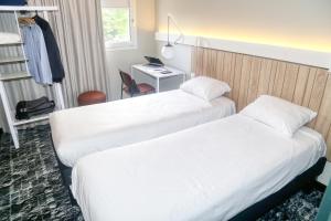 Postel nebo postele na pokoji v ubytování ibis Biarritz Anglet Aéroport