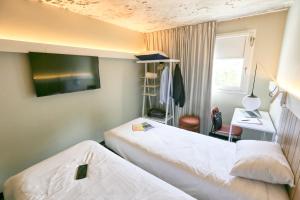 Postel nebo postele na pokoji v ubytování ibis Biarritz Anglet Aéroport