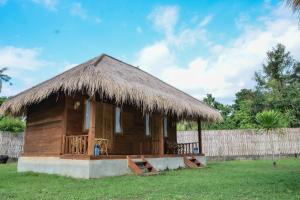 Ein Garten an der Unterkunft Beranda Ecolodge